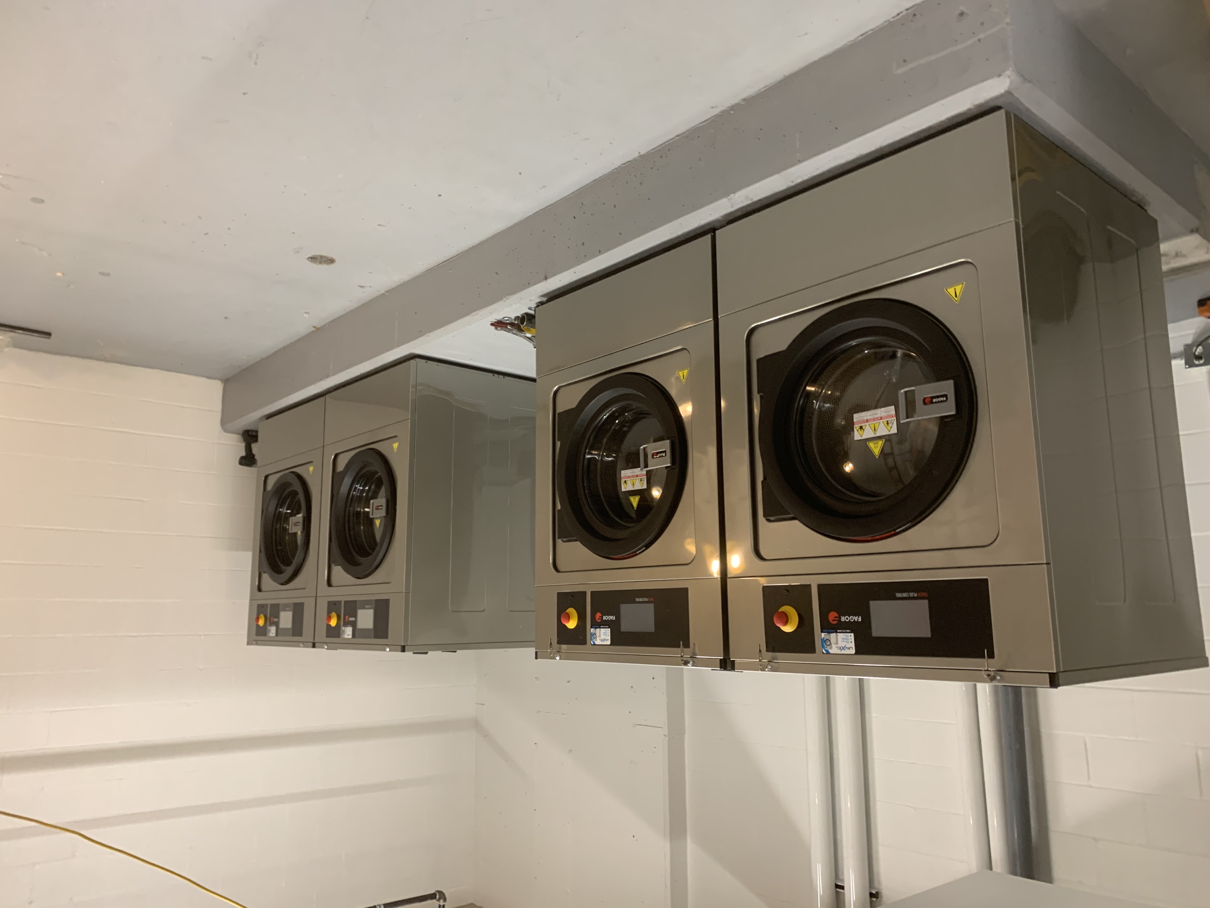 Commercial laundry equipment installation